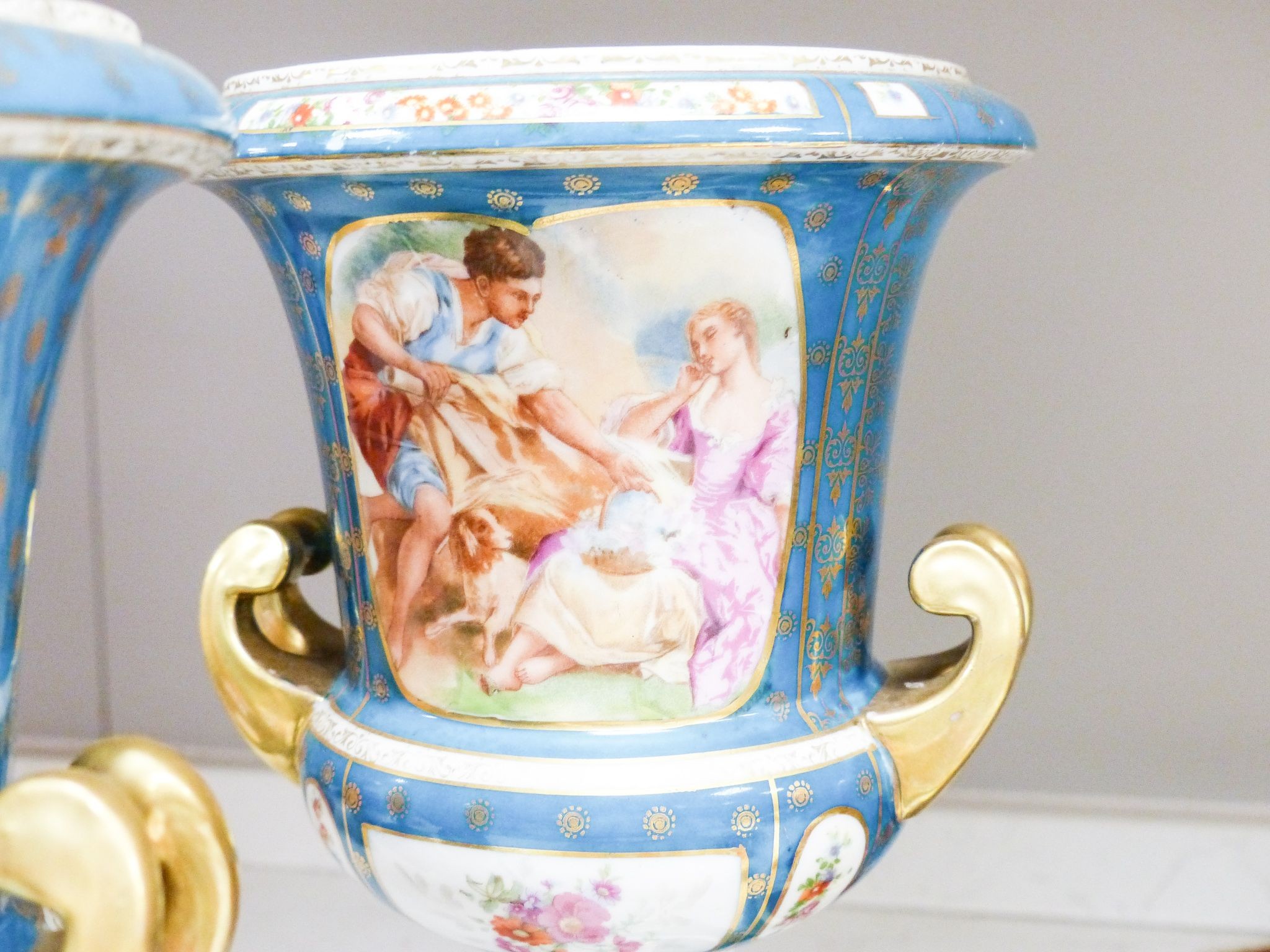 Two Vienna style porcelain chargers, 38cm and a similar pair of pedestal vases, 29cm, early 20th century